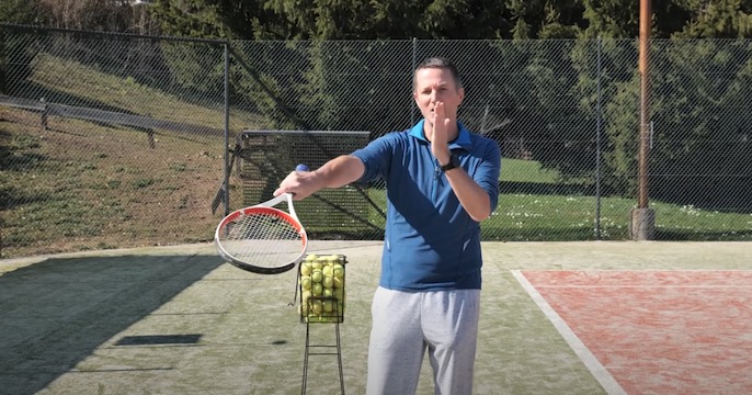 drill to stop carving around the ball when playing tennis slice serve