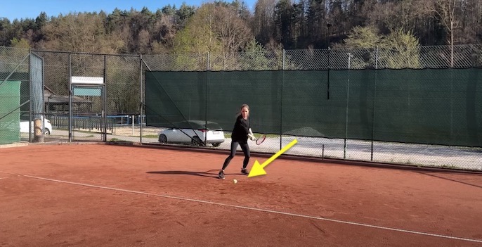 tennis ball landing behind baseline
